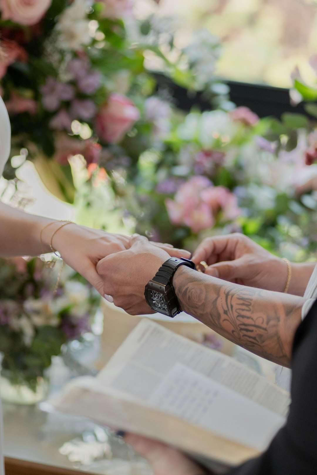 services-02 a-bride-and-groom-holding-hands-during-a-wedding-ceremony-ckqv7-bv3cu